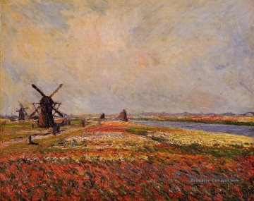 Champs de fleurs et moulins à vent près de Leiden Claude Monet paysage Peinture à l'huile